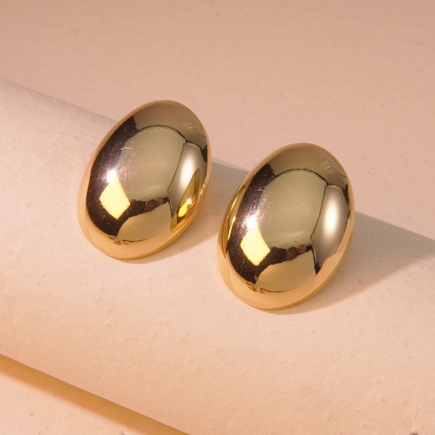 Aretes botón brilloso chuncky